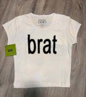 NWT Official Charli XCX white Brat Crop Top Baby Tee Size S Hyperpop Y2K Rave